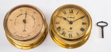A Smiths Empire brass bulkhead clock: with Roman numerals and subsidiary seconds dial, 18.