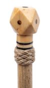 A 19th century marine ivory walking cane: the tetradecahedron pommel inset with tortoiseshell dots
