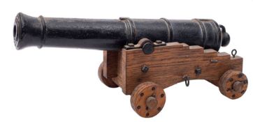 A cast iron desk cannon:,
