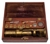 A 19th century lacquered brass microscope by H Comyns, Chelsea,