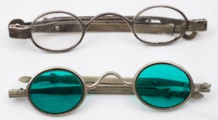A pair of 19th century silver spectacles: with clear oval lenses and extendable arms,