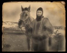 A large photogravure print of F E Davies: in seal skins with an expedition mule, 40cm x 50.2cm.