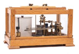 An oak cased combination barograph and thermograph: by On , serial number 5175,