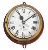 A late 19th century brass bulkhead timepiece by Whyte, Thomson & Co,