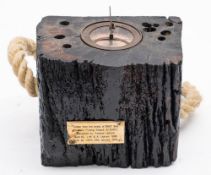 A salvaged section of timber from the Brixham Fishing Smack 'Ibex': inset later brass equinox dial