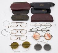 Four pairs of steel framed spectacles:,