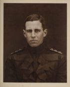 A framed half-length photogravure portrait of Captain L E G Oates after the original by G Lekegain