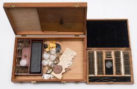 Two optician's small cased test sets: together with a leather cased opticians test set: comprising