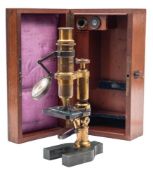 An early 20th century French brass compound microscope by E Hartnack & A Prasmowski,