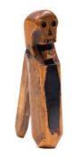 A 19th century treen nut cracker with carved skull decoration:,