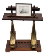 A pair of cast brass dolphin bell stands:,