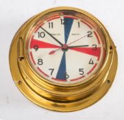 An Observer Electro brass cased quartz radio room bulkhead clock: 22cm diameter.