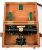 A black lacquered brass level:, unsigned, the 7 inch main tube with spirit bubble above,