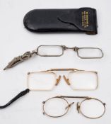 A pair of gold plated pince nez in a Preston Drug Co.