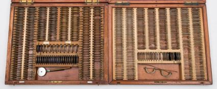Two optician's mahogany cased test sets:, both unnamed.