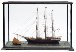 A late 19th/early 20th century cased scale waterline model of the clipper Pretty Polly: standing