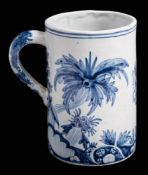 A Delft tankard in 18th Century style with armorial between palm tree style foliage: 14cm high