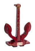 A cold painted bronze miniature presentation Navy stocklass style anchor: overpainted in red and