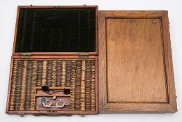 An optician's cased test set in a stained beech case:,