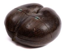 (Lodoicea maldivica) A late 19th century Coco de mer: with hinged upper section and geometric