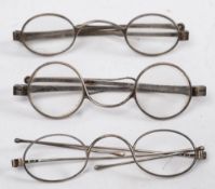 Three pairs of 19th century silver spectacles:, the pair London 1826,
