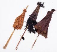 A group of three late Victorian/Edwardian parasols: the first with horn handle carved with beads