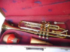 A Boosey and Hawkes Imperial brass trumpet: with inset mother-of-pearl stops and three spare