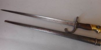 A French 1874 pattern Gras bayonet: the 52cm T-shaped blade inscribed Mre d'Armes de St.