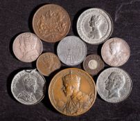 A bronze Coronation 1911 medallion: with white metal 1862 Exhibition medallion with silver 1911