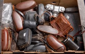 A collection of various cameras including: 35mm and others.