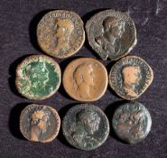 A group of seven Roman copper coins: including Trajan, Germanicus, Philip etc and a Ptolemaic coin.
