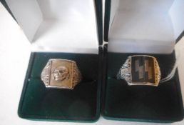 Two Third Reich period style tote rings: one with Totenkopf deaths head, the other with SS runes.