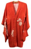 A mid-20th century silk Haori: with printed floral pattern to a salmon pink ground together with a