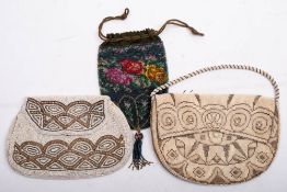 An early 20th century beadwork miser's purse: with floral decoration,