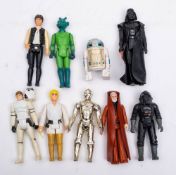 A group of vintage Star Wars figures: 'Darth Vader', 'Han Solo', 'Luke Skywalker' , 'Greedo',