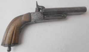 A mid 19th century double barrel pin fire pistol: with 9.