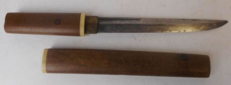 A Japanese tanto: with 19cm single edged blade, with wood tsuka and wood saya, overall length 31.