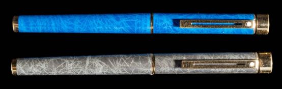 Two Sheaffer Targa fountain pens: one in Laque Blue Ronce (slight damage) the other in Grey Ronce