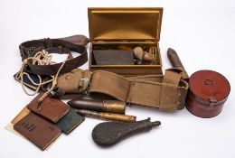 A collection of militaria: including cartridge cases, webbing collar box, shot flasks,