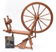 An oak and ash Saxony pattern spinning wheel by Willam Gordon,