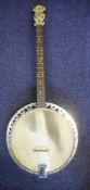 A May Bell four string banjo: with nineteen fret with faux mother-of-pearl inset head and ivorine