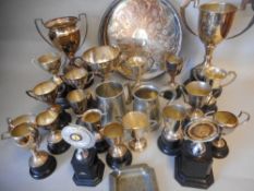 A collection of silver plated trophy cups: mugs, ashtray and salver all awarded to R.C.