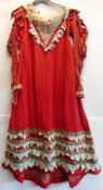 An adapted Regency period red crepe and silk dress: with high waisted panel front,