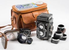 A Rolliflex twin lens reflex camera: serial number 1715858, fitted with Carl Zeiss 75mm lens,