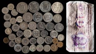 A collection of various Swiss coins and a note: