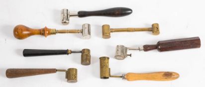 A group of seven various dram measures: