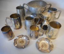 A Tudric pewter presentation mug: inscribed B & A.M.C.C. H.M.