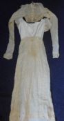 A Regency period white cotton lawn dress: with high waisted panel front and all-over embroidered