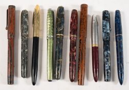 A group of ten vintage fountain pens: including a Blackbird Self- filling pen by Mabie,