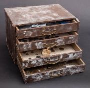 A four drawer cabinet containing a selection of coins including pre 1947 silver £5 coins etc.